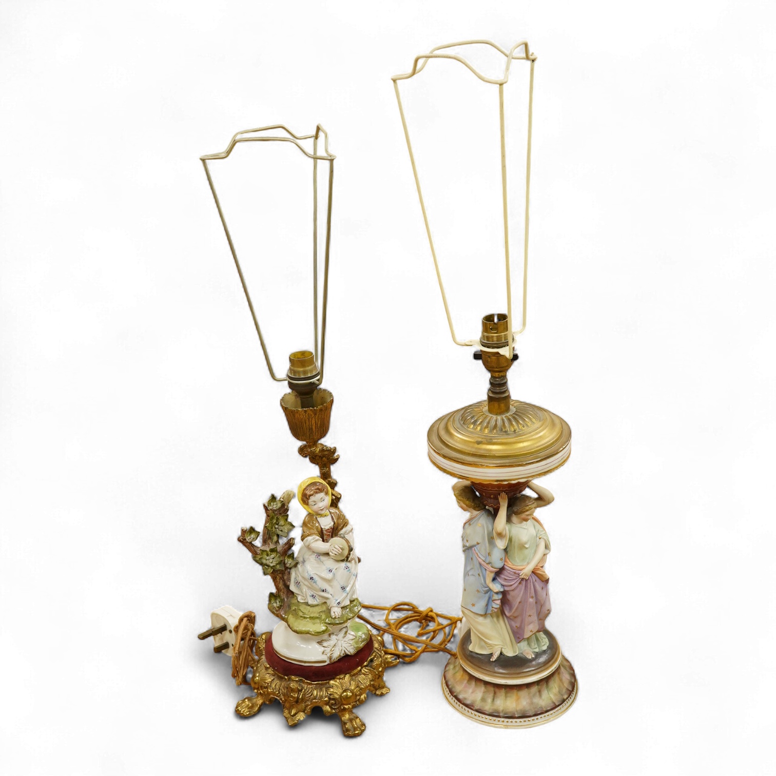 A Continental Three Graces table lamp and another table lamp mounted with a seated figure, largest 44cm high including the fitting